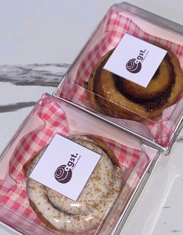 Two agst. cinnamon rolls packed in branded boxes