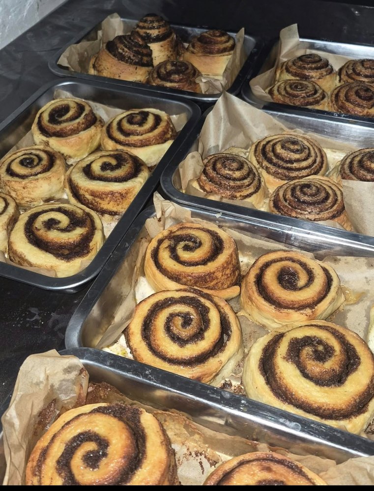 Trays of freshly baked agst. cinnamon rolls